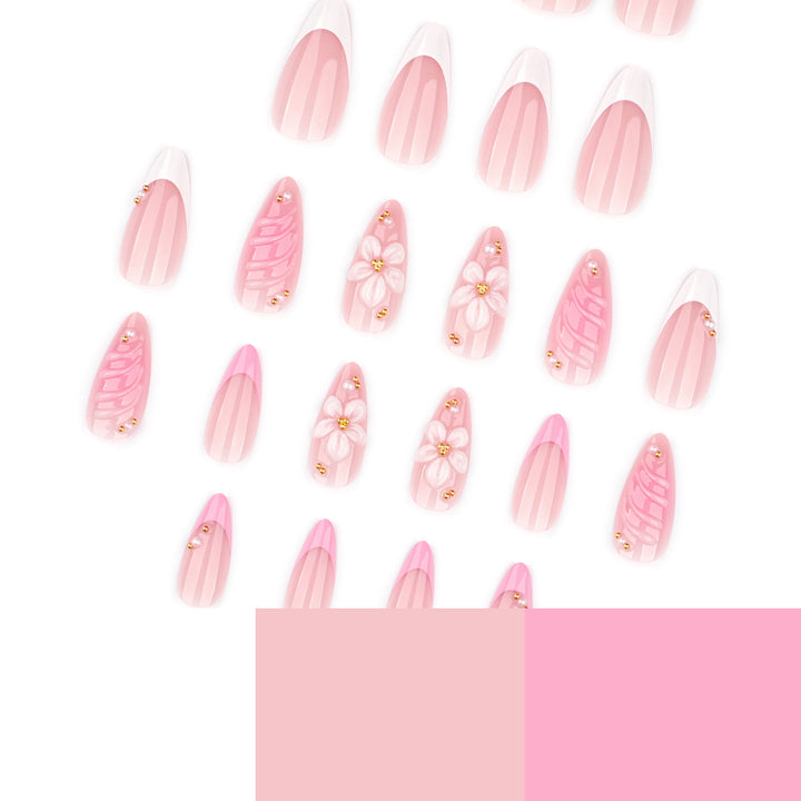 Artificial nail art with floral design and glitter accents Bowlift