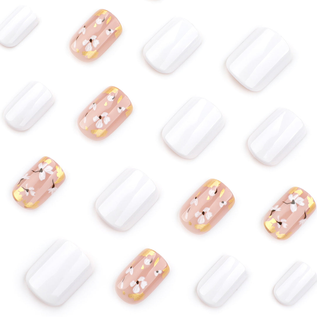Artificial nail art with delicate flowers and glitter accents Bowlift