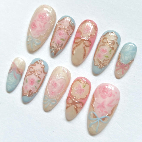 Artistic acrylic nails with floral designs Bowlift