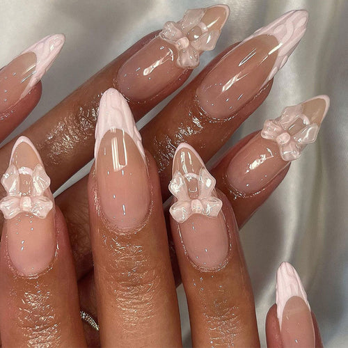 Artistic Nail Extensions with Transparent Bow Accents Bowlift