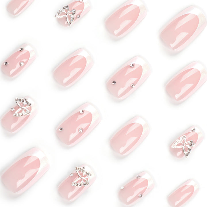 Elegant Nail Art with Glitter and Floral Accents Bowlift