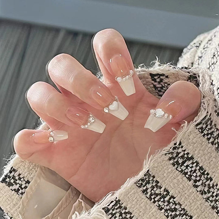 Artificial nails with heart accent and glamorous decorations Bowlift