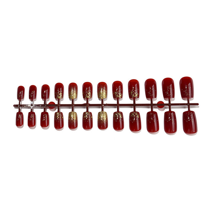 Elegant Press-On Nail Set with Glamorous Gold Glitter Accents Bowlift
