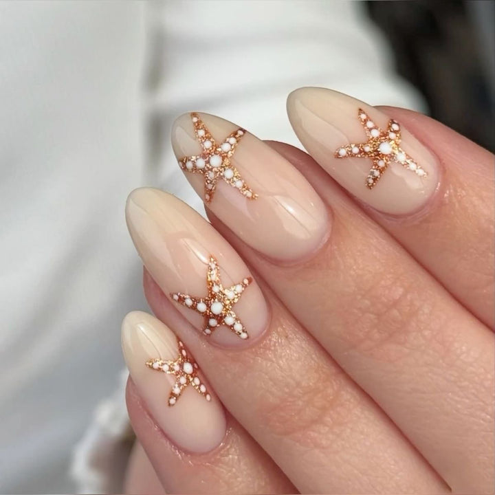 Artistic acrylic nails with maritime star designs Bowlift