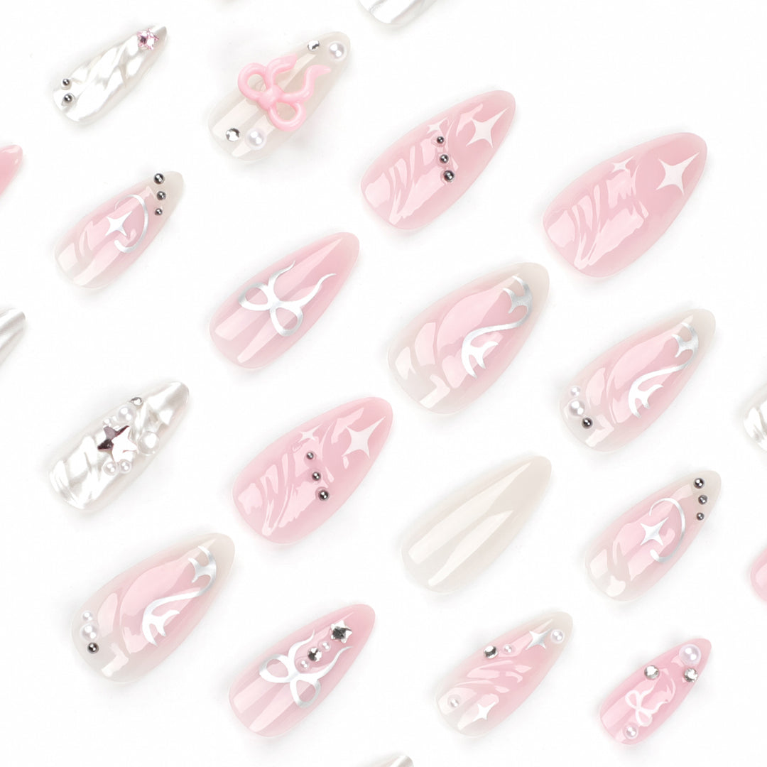 Artful stiletto nails in an elegant design with creative embellishments Bowlift