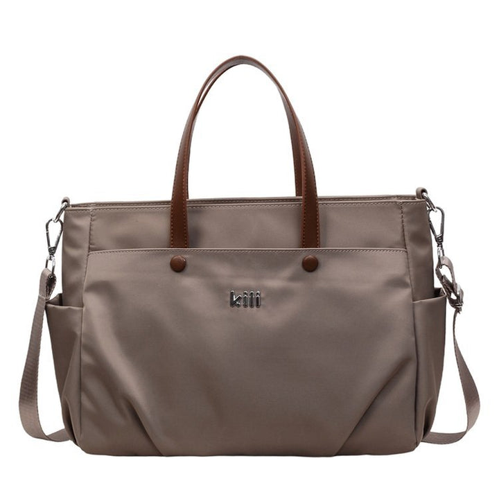 Shopping bag with comfortable carrying system and practical outer pockets Bowlift