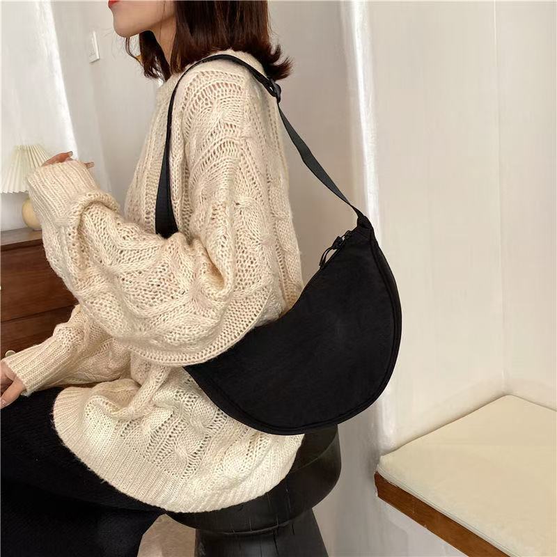 Shoulder bag with practical compartment system and adjustable shoulder strap Bowlift