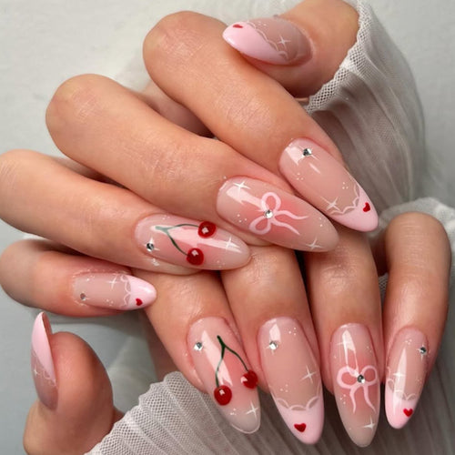 Artifical nails with playful heart and bow designs Bowlift