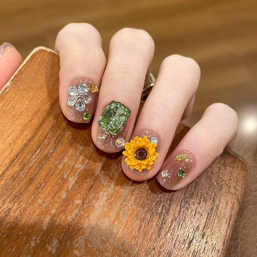 Artificial nails with sparkling appliqués and floral designs Bowlift