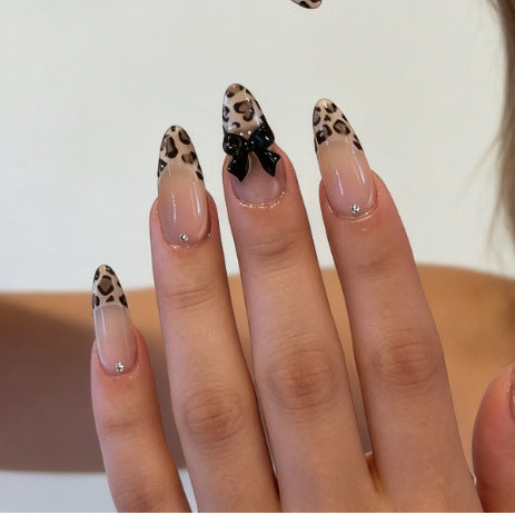 Artificial nail tips with elegant leopard pattern and bow decoration Bowlift