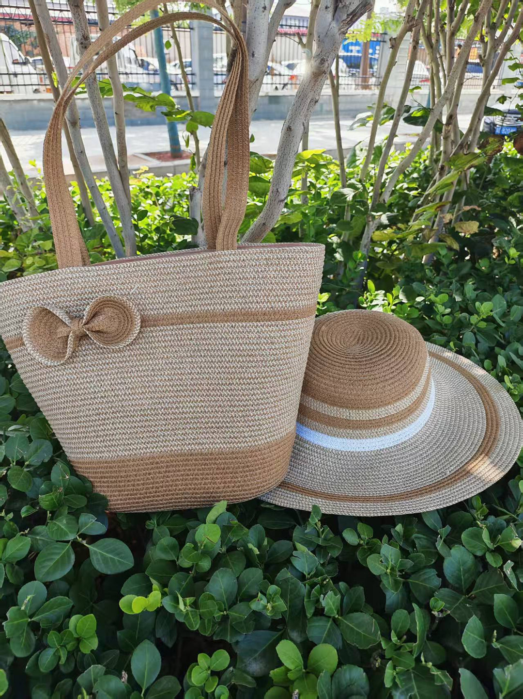 Elegant sun hat with wide brim and subtle stripe pattern Bowlift
