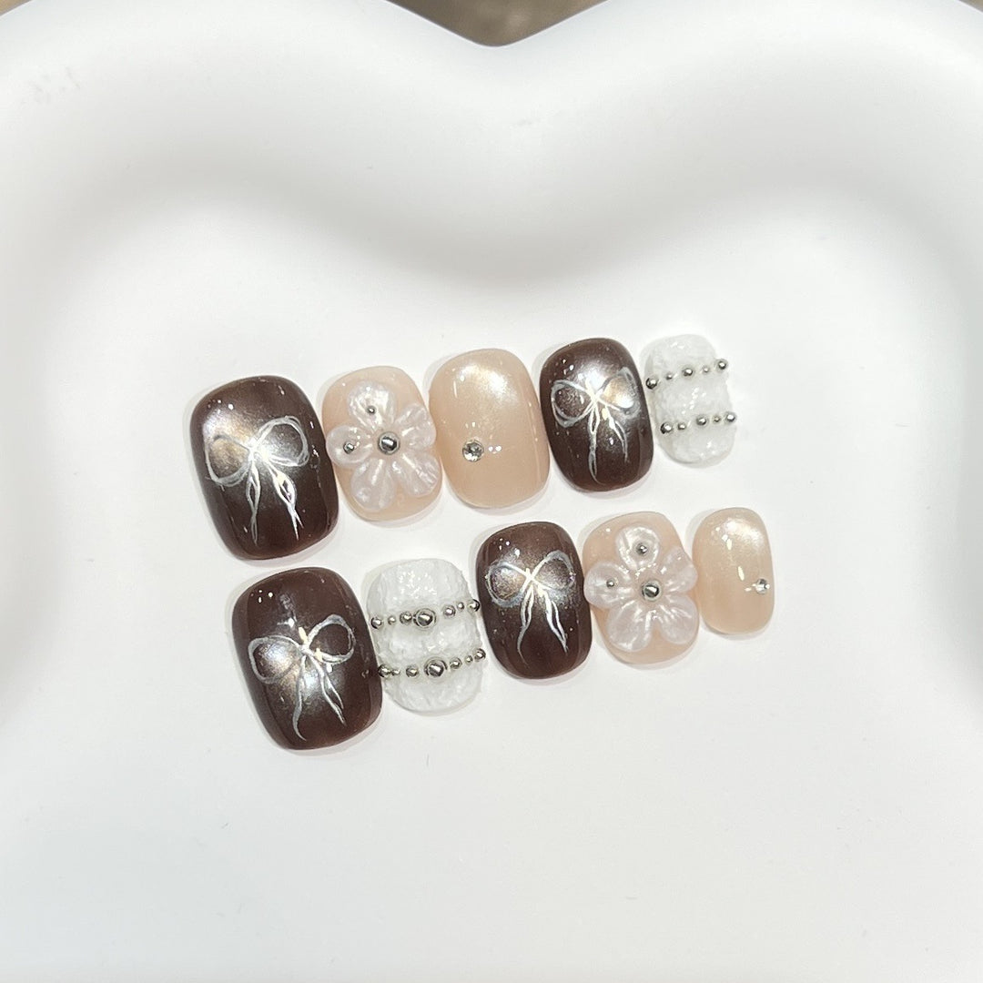 Elegant Stiletto Press-On Nail Set with Decorative Accents Bowlift