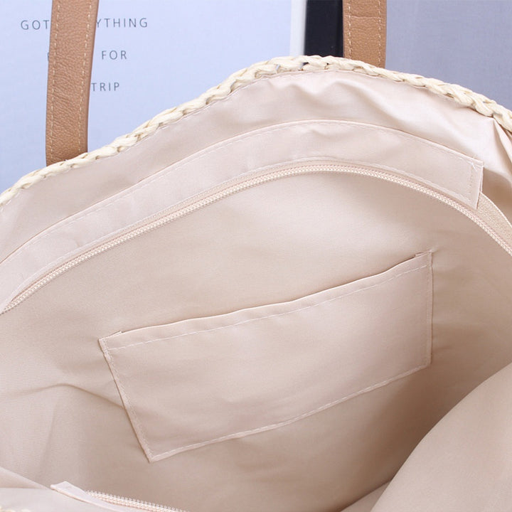 Handwoven beach bag made of natural materials with leather accents Bowlift