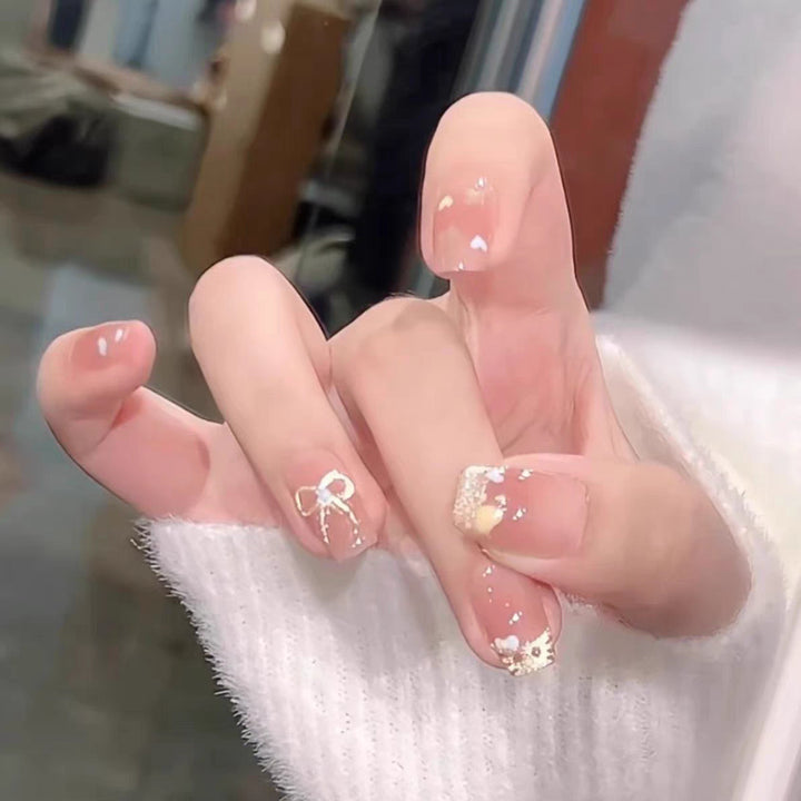 Artistic Press-On Nail Set with Floral and Heart Designs Bowlift