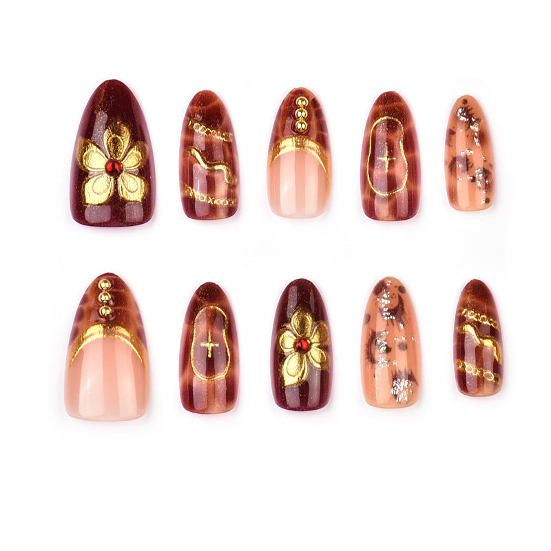 Deluxe artificial nails with golden accents Bowlift