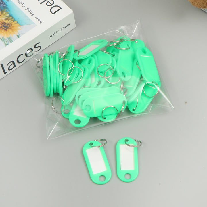 Unisex writable keychain with clear labeling field Bowlift