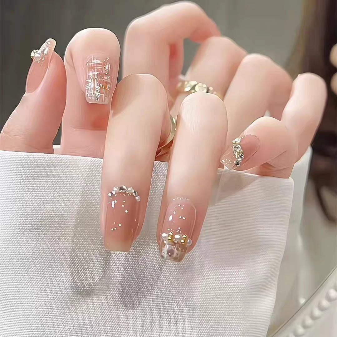 Artificial nails with elegant pearl and glitter decorations Bowlift