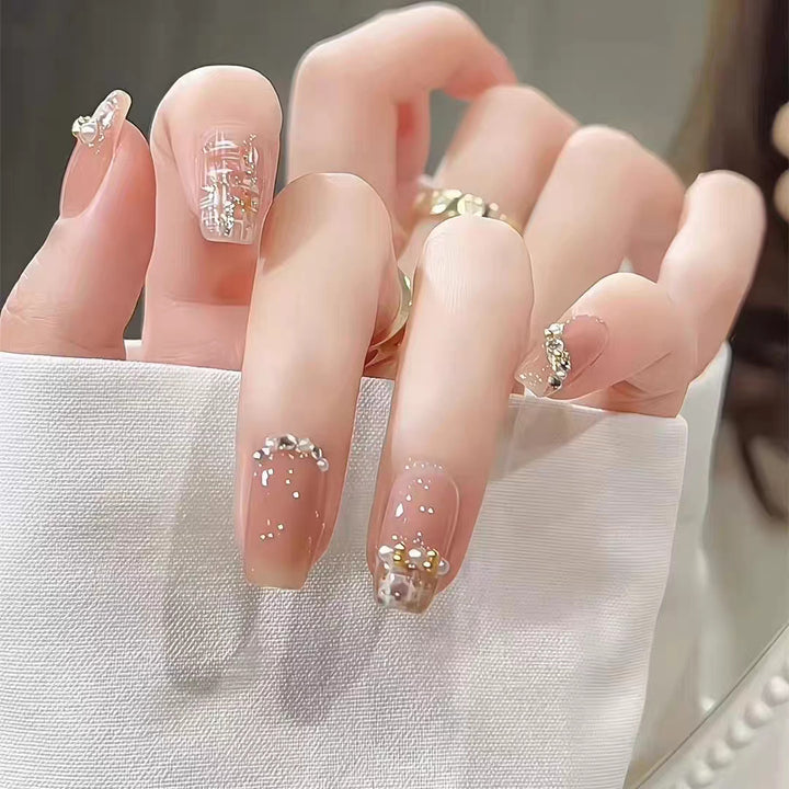 Artificial nails with elegant pearl and glitter decorations Bowlift