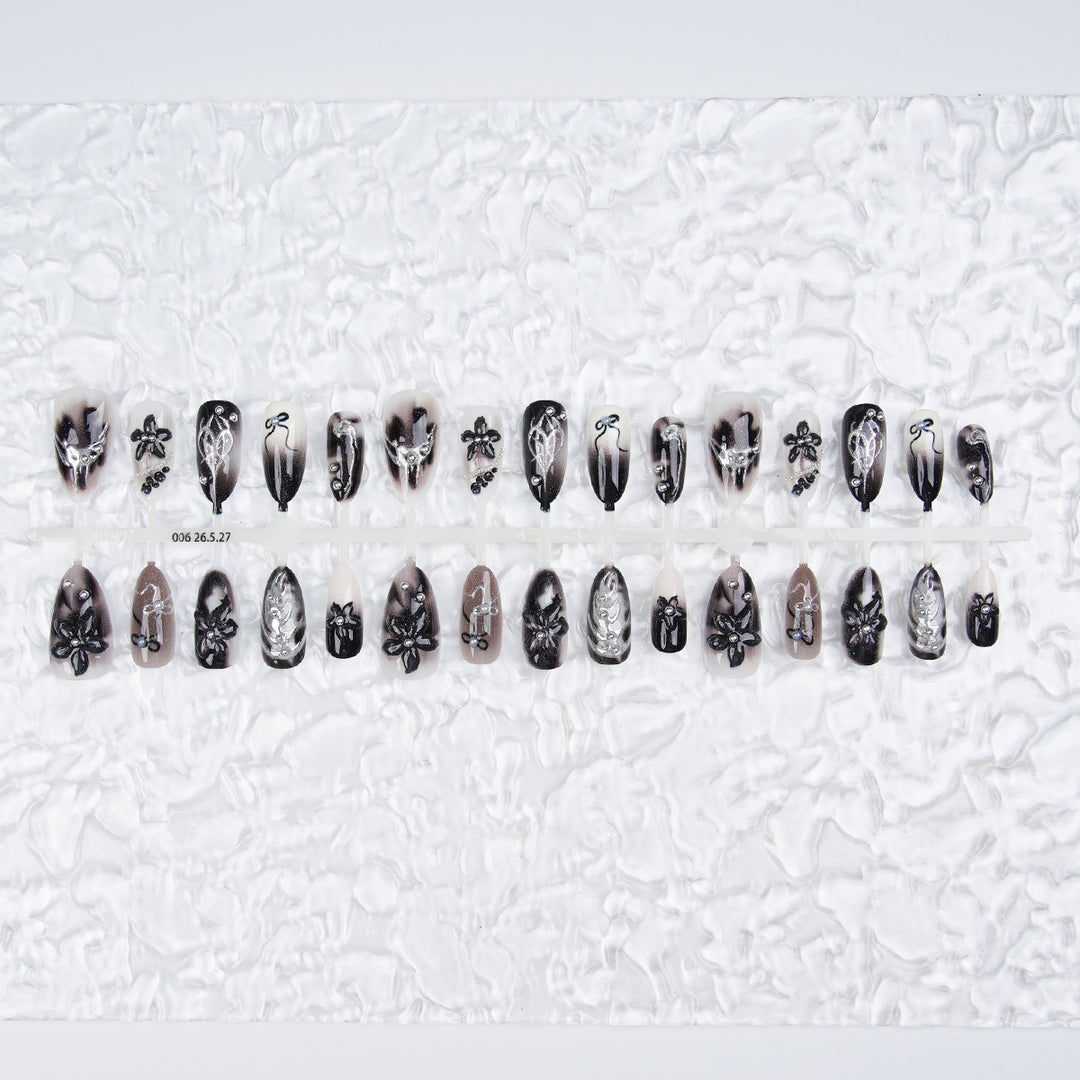 Elegant acrylic nail set with complex designs Bowlift