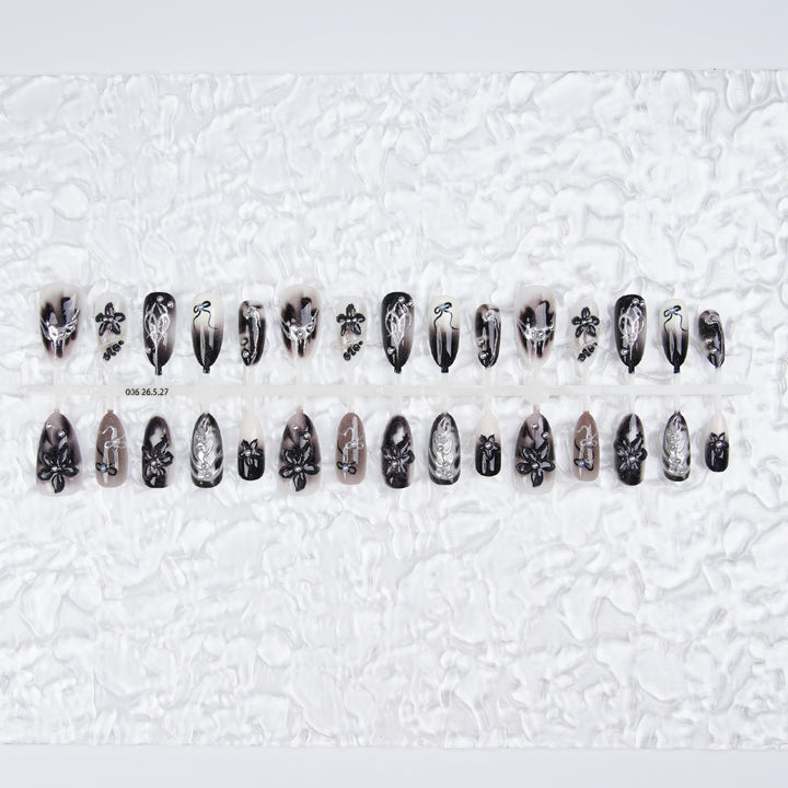 Elegant acrylic nail set with complex designs Bowlift