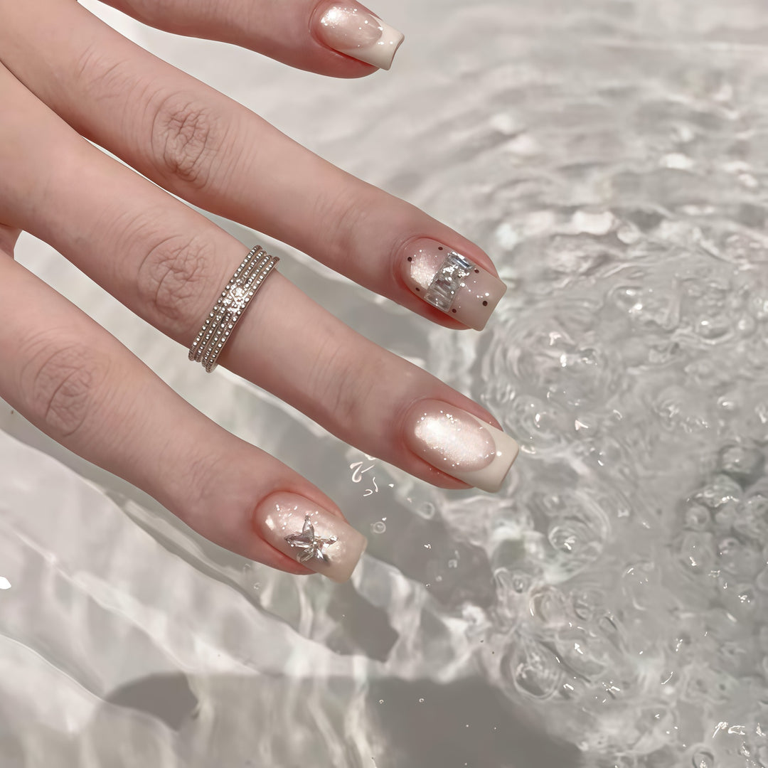 Elegant artificial nails with shimmer and glitter Bowlift