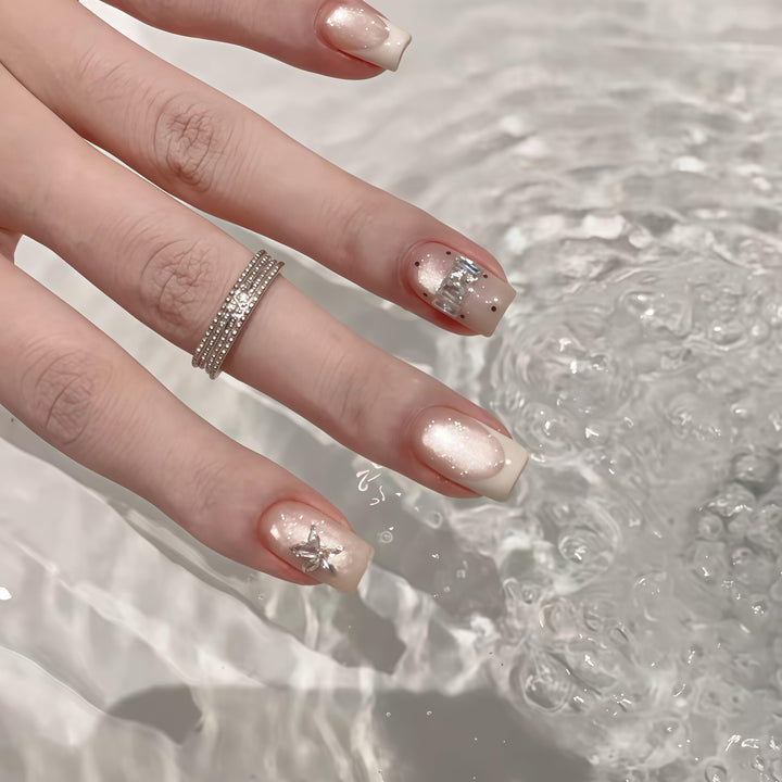 Elegant artificial nails with shimmer and glitter Bowlift