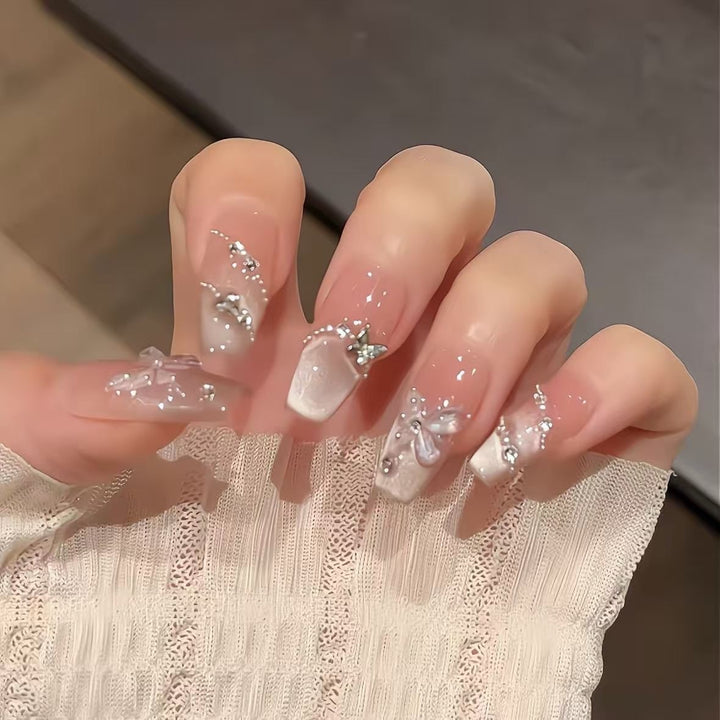 Artificial nails with glamorous decorations and shine Bowlift