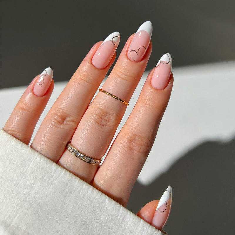 Elegant French Tip Press-On Nails with Heart Accents Bowlift