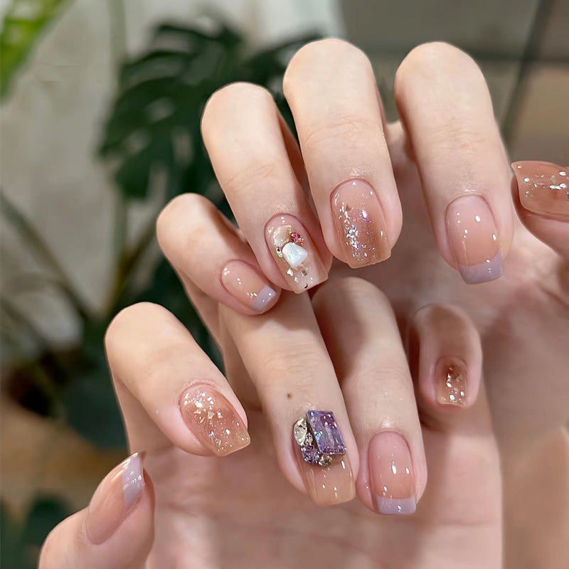 Elegant Press-On Nail Set with Artistic Glitter and Decorative Accents Bowlift