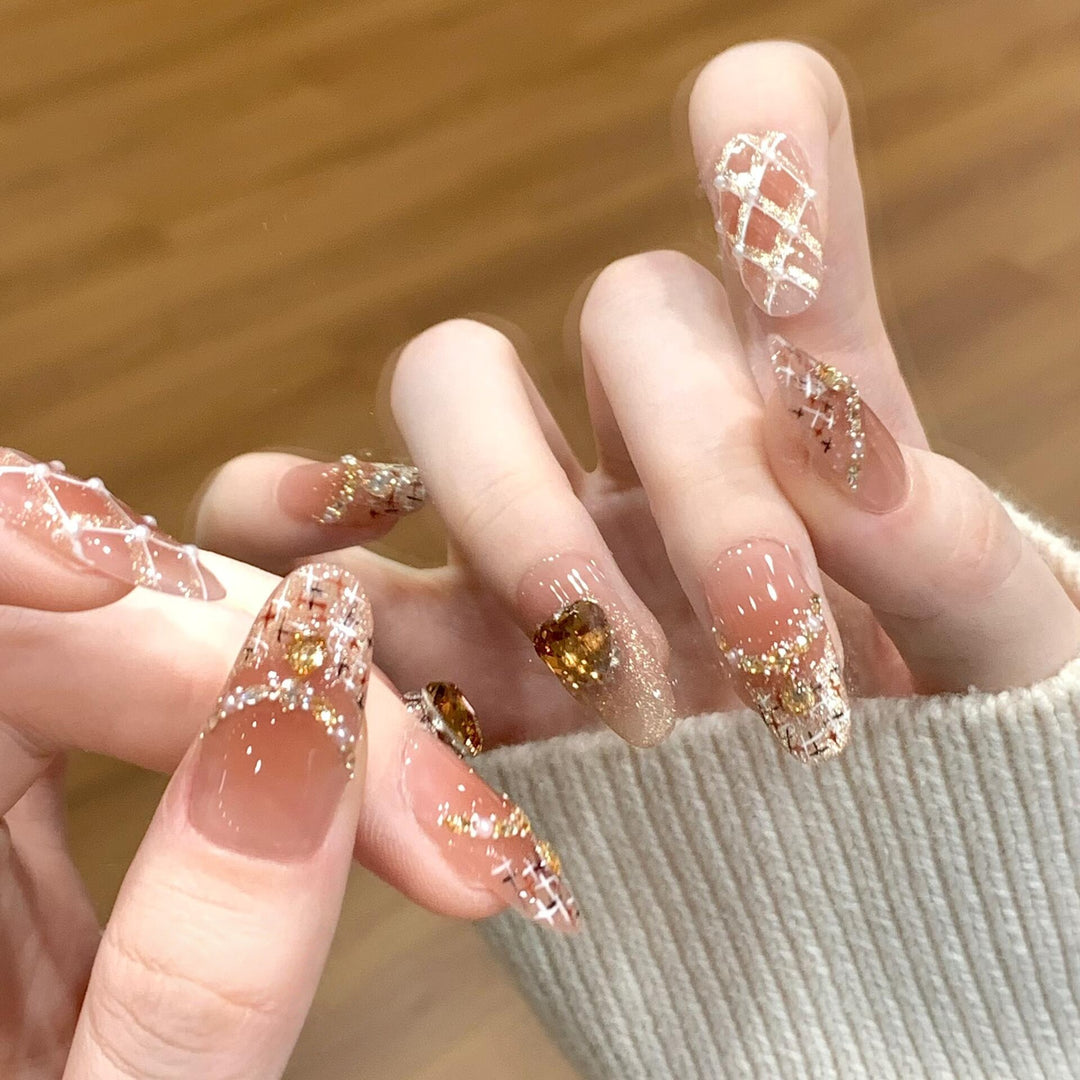 Glamorous artificial nails with glitter and heart design Bowlift