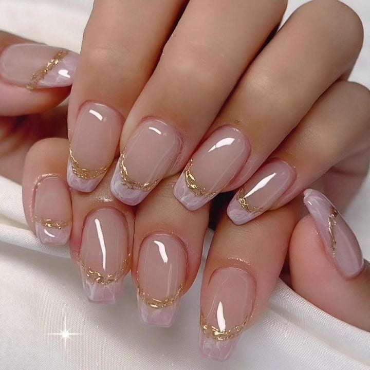 Elegant artificial nails with gold accents Bowlift