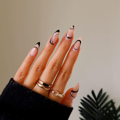 Artful stiletto nails with geometric accents Bowlift