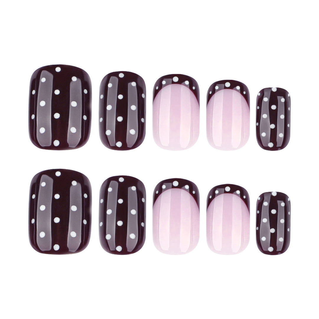 Artful nail art with elegant polka dot design Bowlift