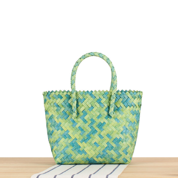 Tote bag made of handwoven natural material with braided design Bowlift