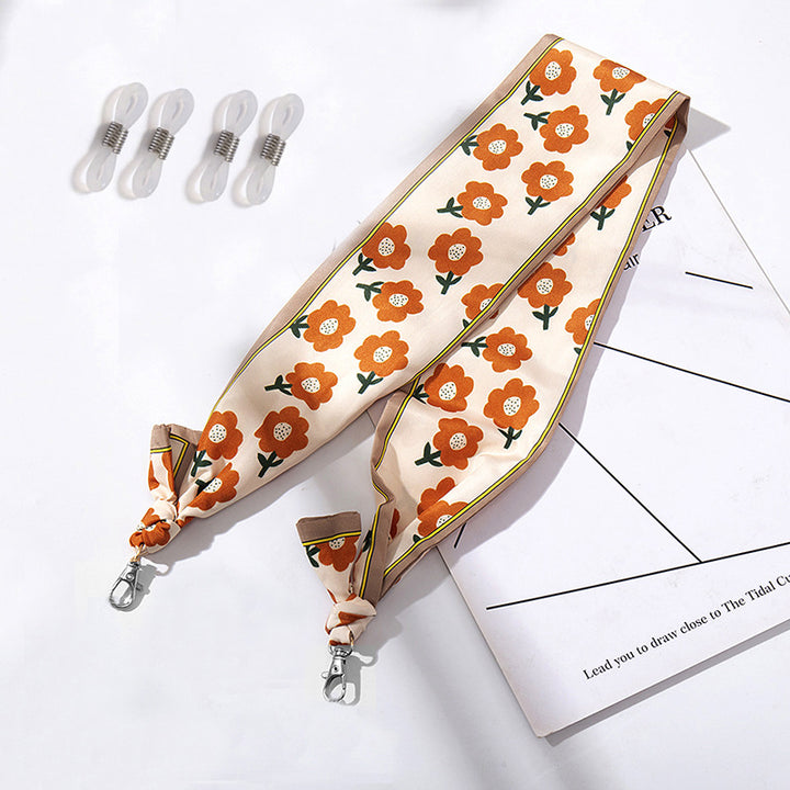 Fashionable fabric mask holder with floral motifs Bowlift