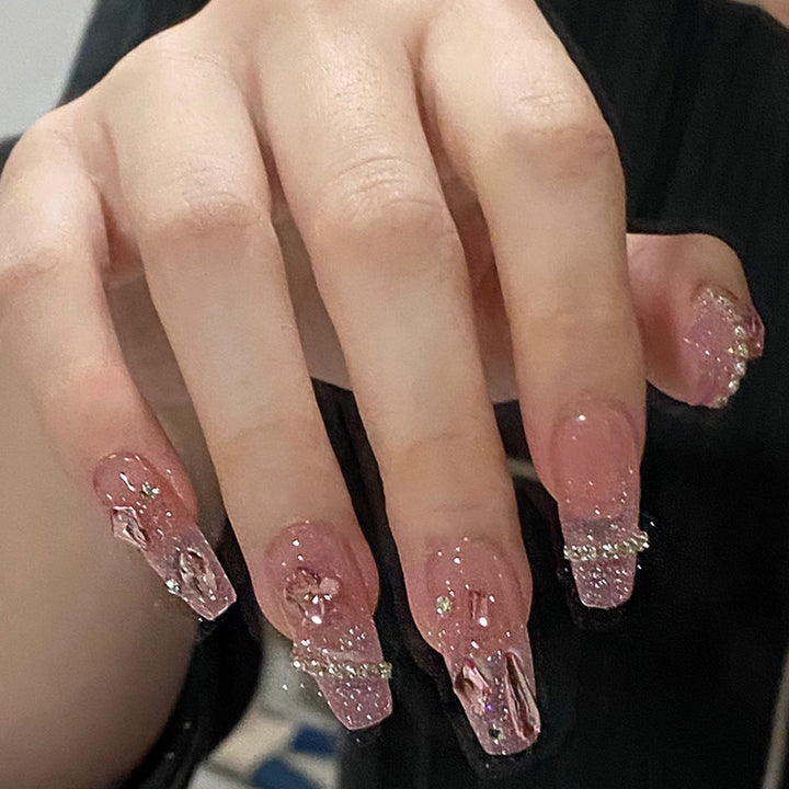 Artificial nails with heart design and glitter accents Bowlift