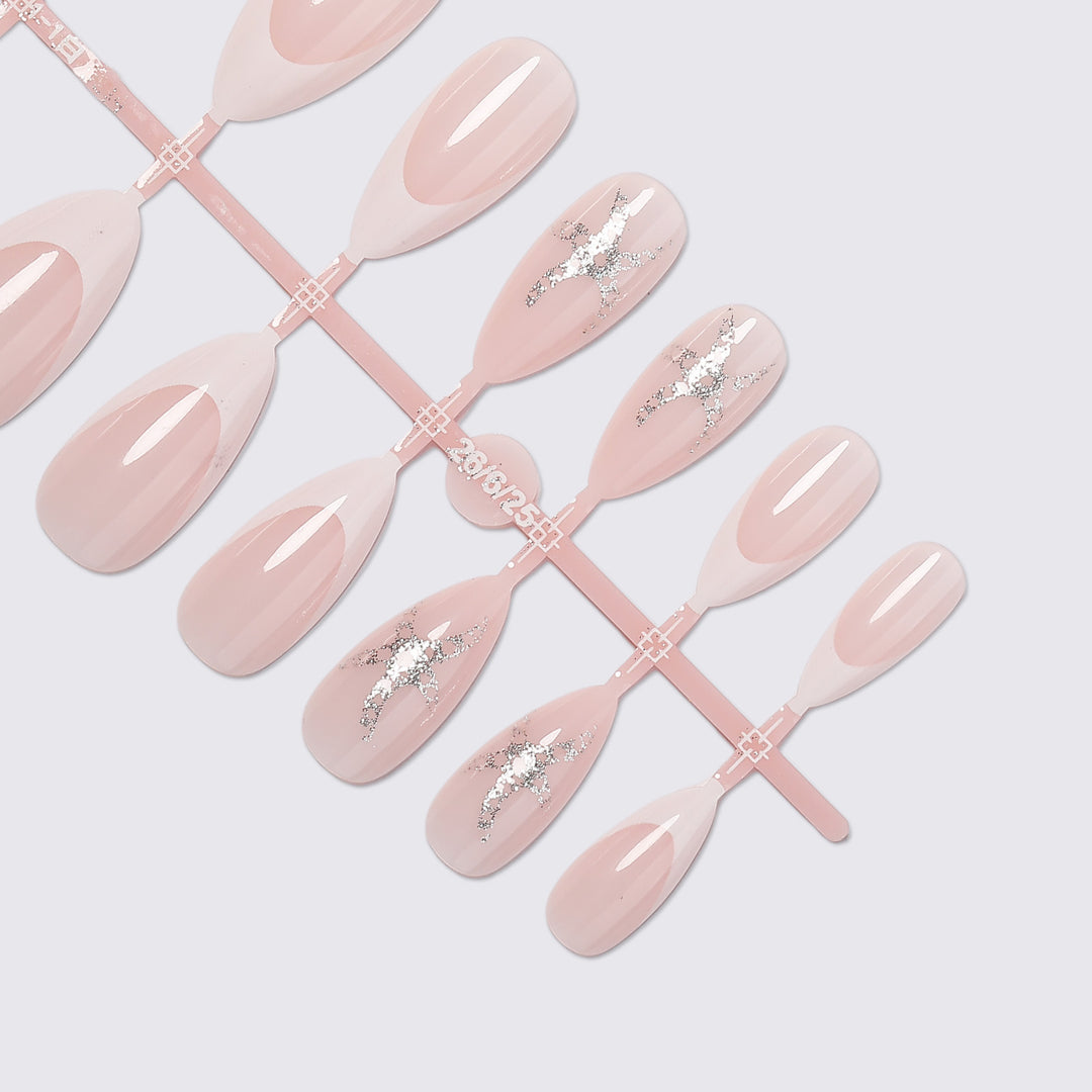 Artificial nail set with delicate pearlescent and glitter accents Bowlift
