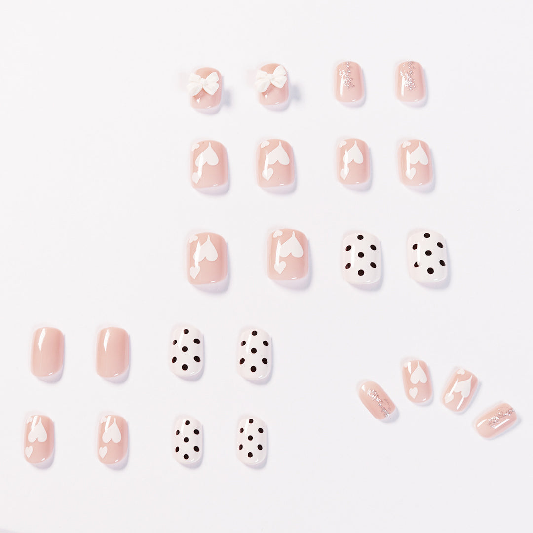 Artful nail art with delicate flower and heart motifs Bowlift