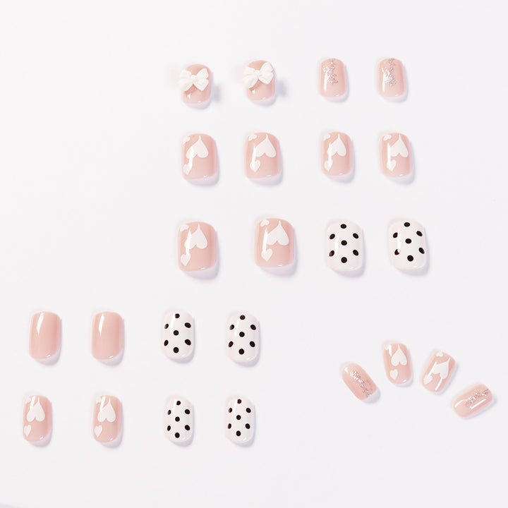 Artful nail art with delicate flower and heart motifs Bowlift