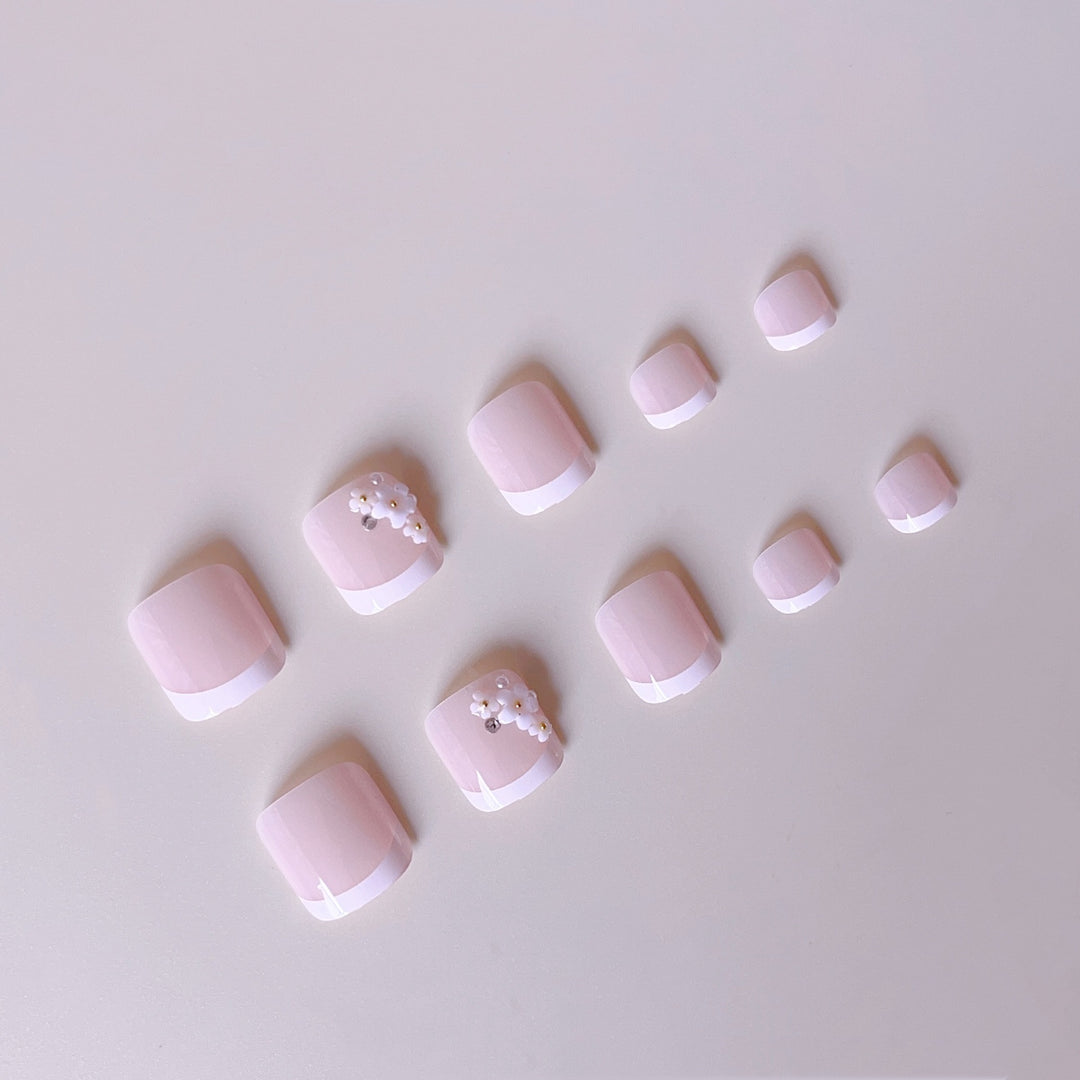 Elegant toenail art with delicate 3D floral decorations Bowlift