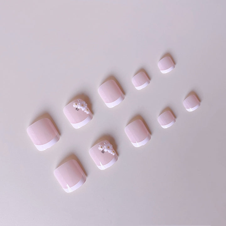 Elegant toenail art with delicate 3D floral decorations Bowlift