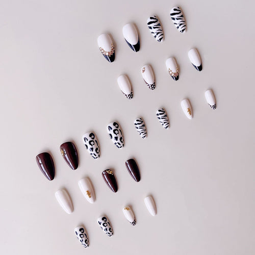 Acrylic nail set with luxurious animal motif designs and glamorous accents Bowlift