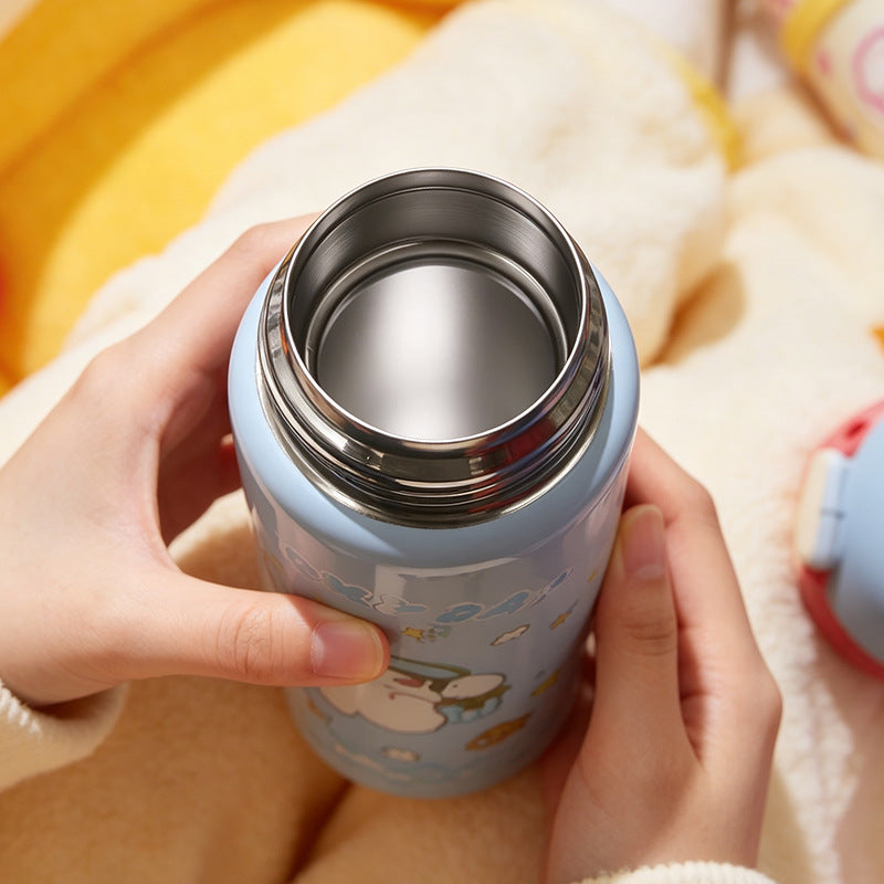 Women's insulated bottle with practical carrying device and playful design Bowlift