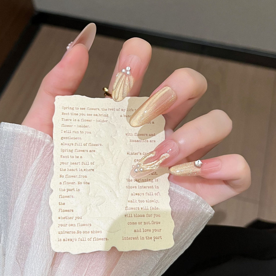 Artistic Stiletto Press-On Nail Art with Glimmering Accents Bowlift