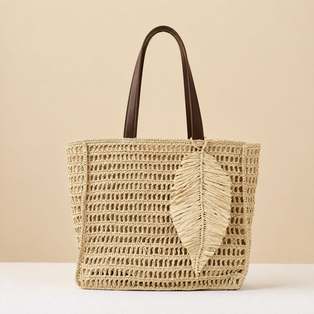 Handbag made of hand-woven natural material with decorative leaf shape design Bowlift
