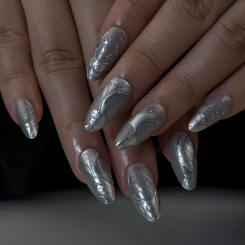 Artistic stiletto nails with elegant silver design Bowlift