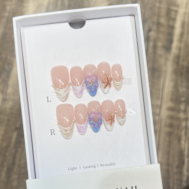 Artistic Press-On Nail Art Set with Floral and Starfish Design Bowlift