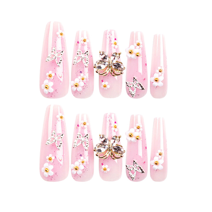Artistic Nail Extensions with Glitter and Floral Accents Bowlift