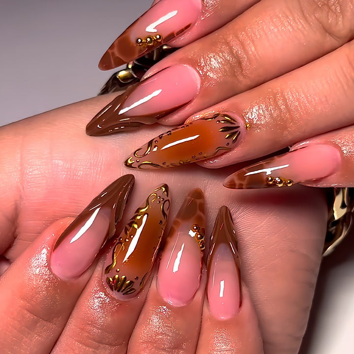 Elegant Stiletto Nail Art Enhancements with Artistic Details Bowlift
