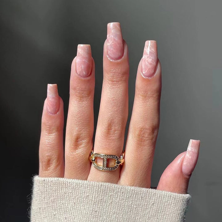 Elegant Nail Extensions with Marbled Accents Bowlift